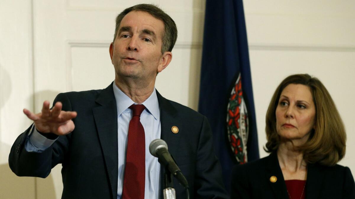 Virginia Gov. Ralph Northam and his wife, Pam. A law firm has completed its investigation into how a racist photo appeared on a yearbook page for Northam.