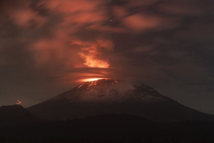 AMECAMECA, MEXICO - MAY 23: Popocatepetl volcano spews incandescent material as seen from Paso de Cortés on May 23, 2023 in Amecameca, Mexico. The second highest volcano in the country increased its activity while Mexican authorities raised the alert to yellow phase 3. Popocatepetl volcano caused the fall of ashes in different municipalities in Puebla, Estado de Mexico and Mexico City. Mexican army has spread forces as a preventive measure while the 3 levels of government are in coordination to observe the activity of the volcano and the situation in the surroundings. (Photo by Cristopher Rogel Blanquet/Getty Images)