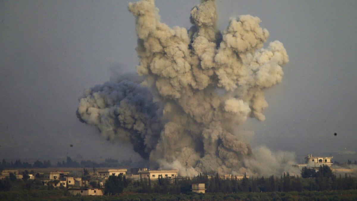 Smoke and explosions from the fighting in southern Syria on Wednesday are shown.