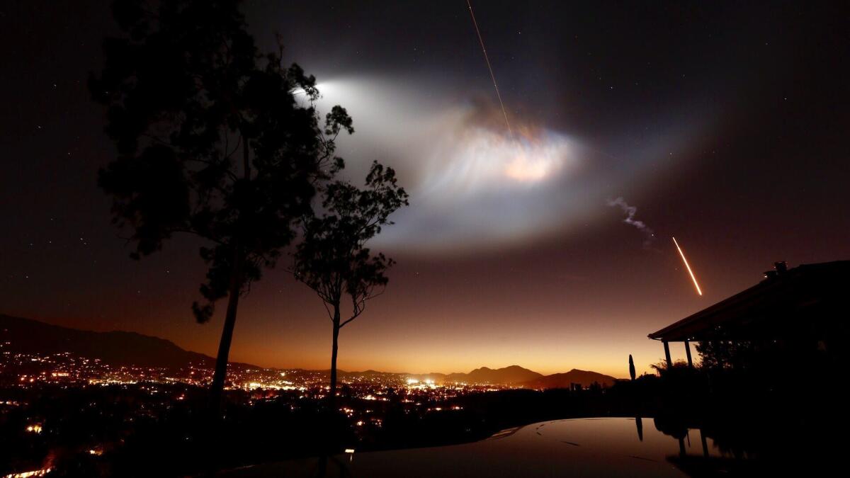 A SpaceX Falcon 9 rocket launch from Vandenberg Air Force Base lights up the Southern California sky in October.