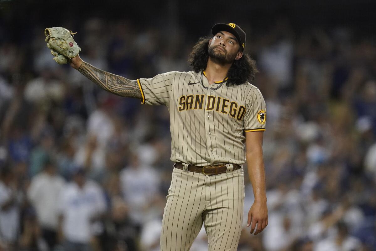 Padres starting pitcher Sean Manaea reacts after giving up a three-run homer to the Dodgers' Mookie Betts 