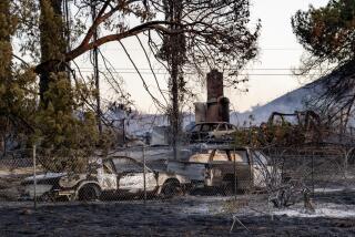 PERRIS, CA - JUNE 27, 2023: Multiple cars and a home are destroyed after the Juniper fire burned along Santa Rosa Mine Road on June 27, 2023 in Perris, California.The Riverside County fire prompted evacuation orders and threatened multiple structures. (Gina Ferazzi / Los Angeles Times)