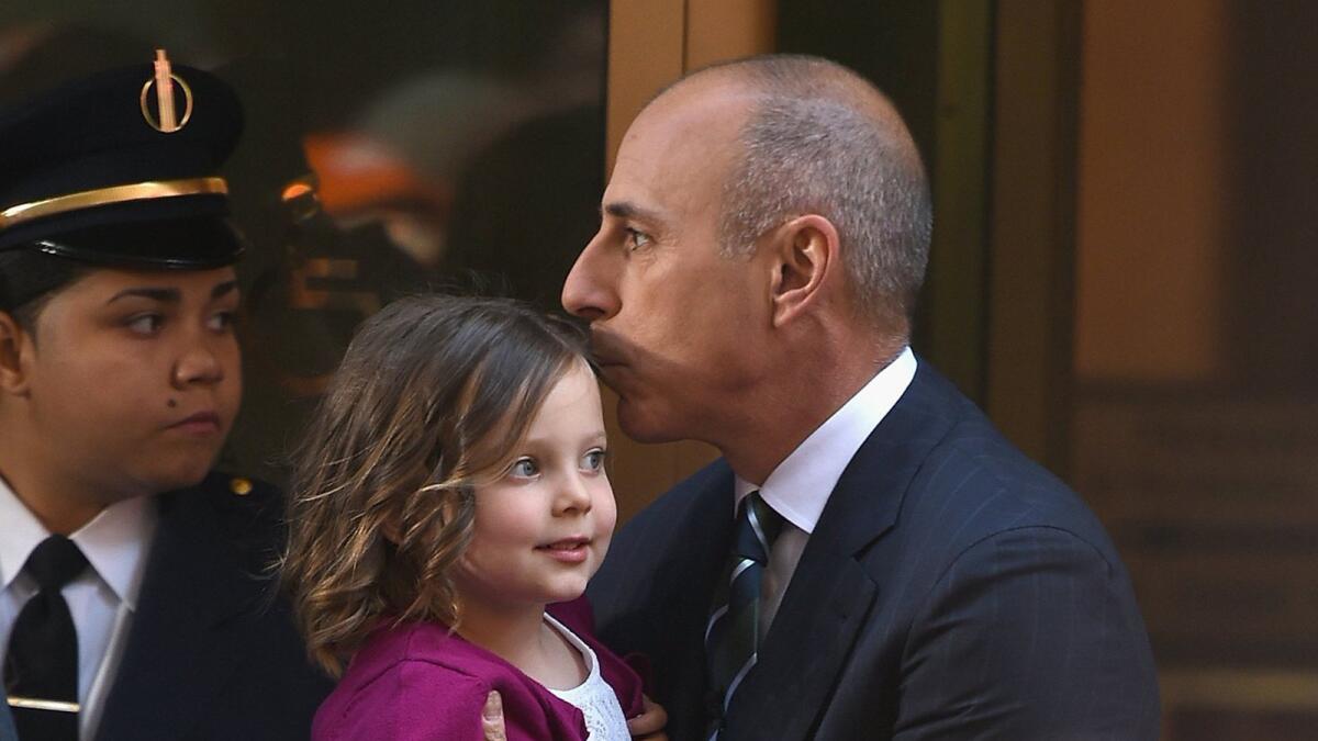 Host Matt Lauer, holding his daughter, heads to work at NBC's "Today" show, which has seen a ratings boost in a key demographic in recent weeks.