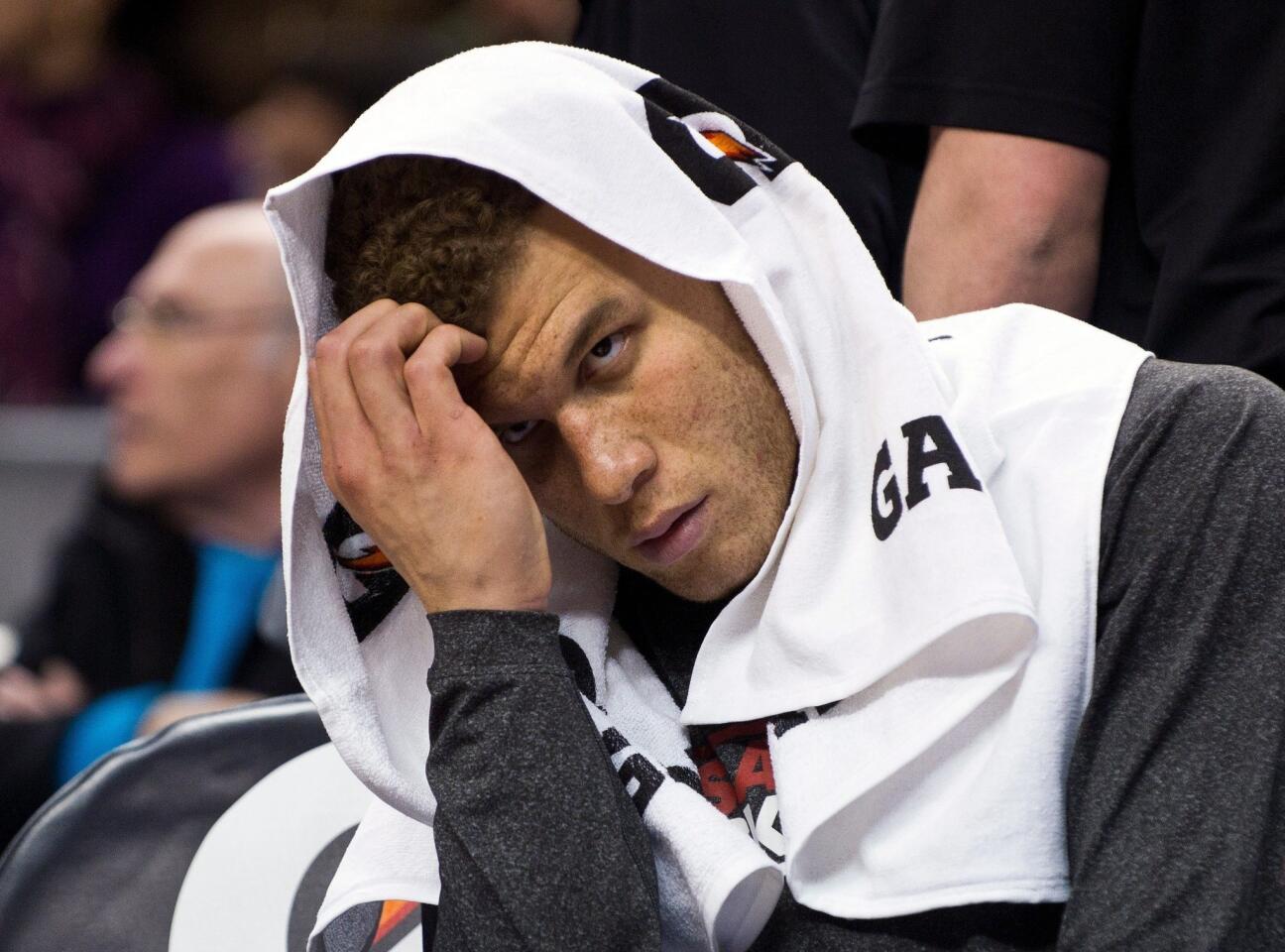 Clippers power forward Blake Griffin watches from the bench as the Raptors pull away for a 98-73 victory on Friday night in Toronto.