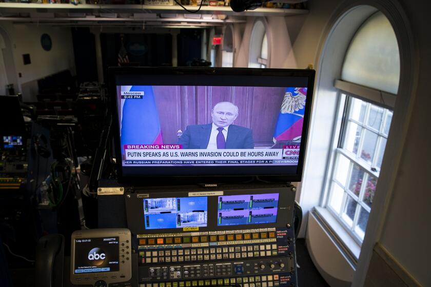 A broadcast of Vladimir Putin, Russia's president, speaking during a news conference plays on a television monitor in the briefing room of the White House in Washington, D.C., U.S., on Monday, Feb. 21, 2022. President Biden will soon issue an executive order that will prohibit new investment, trade, and financing by U.S. persons in the Russian-backed separatist areas of Ukraine, according to a statement from press secretary Jen Psaki. Photographer: Al Drago/Bloomberg via Getty Images