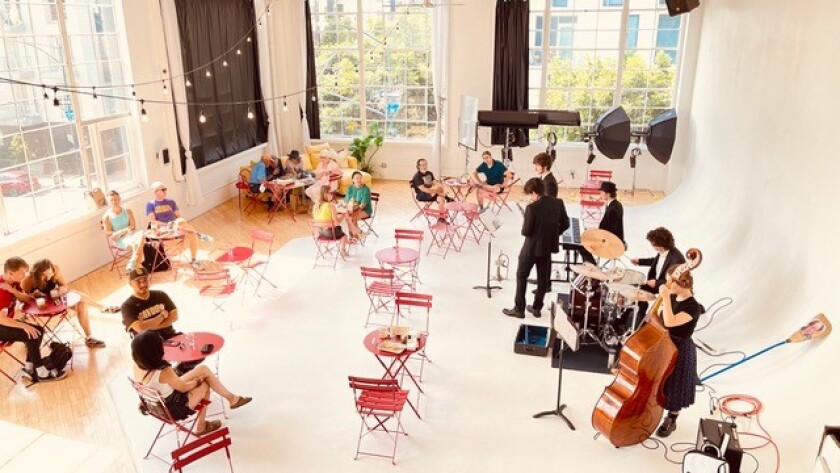 Izola Bakery customers enjoy pastries during a Saturday concert at the East Village loft.