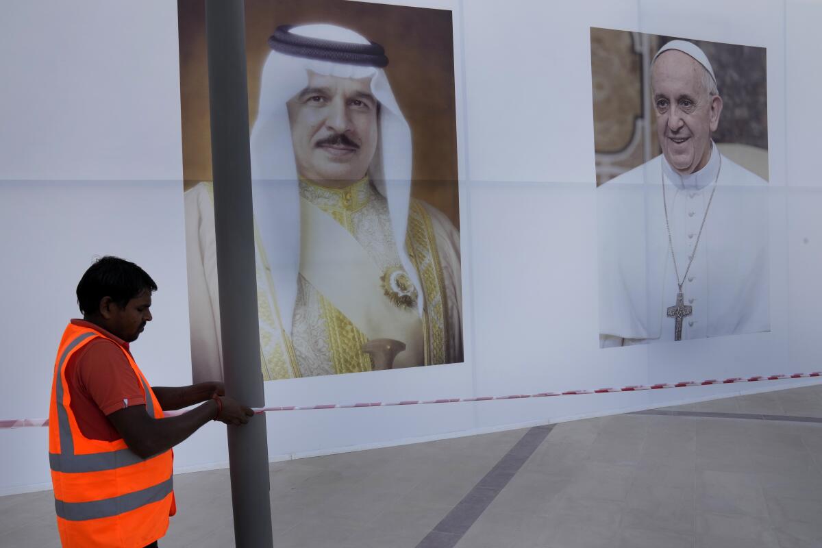 Portraits of Pope Francis and Bahrain's King Hamad bin Isa Al Khalifa