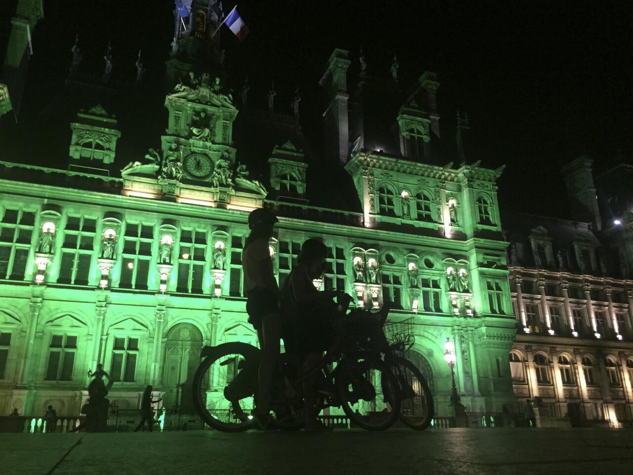 Cities glow green in support of Paris climate agreement