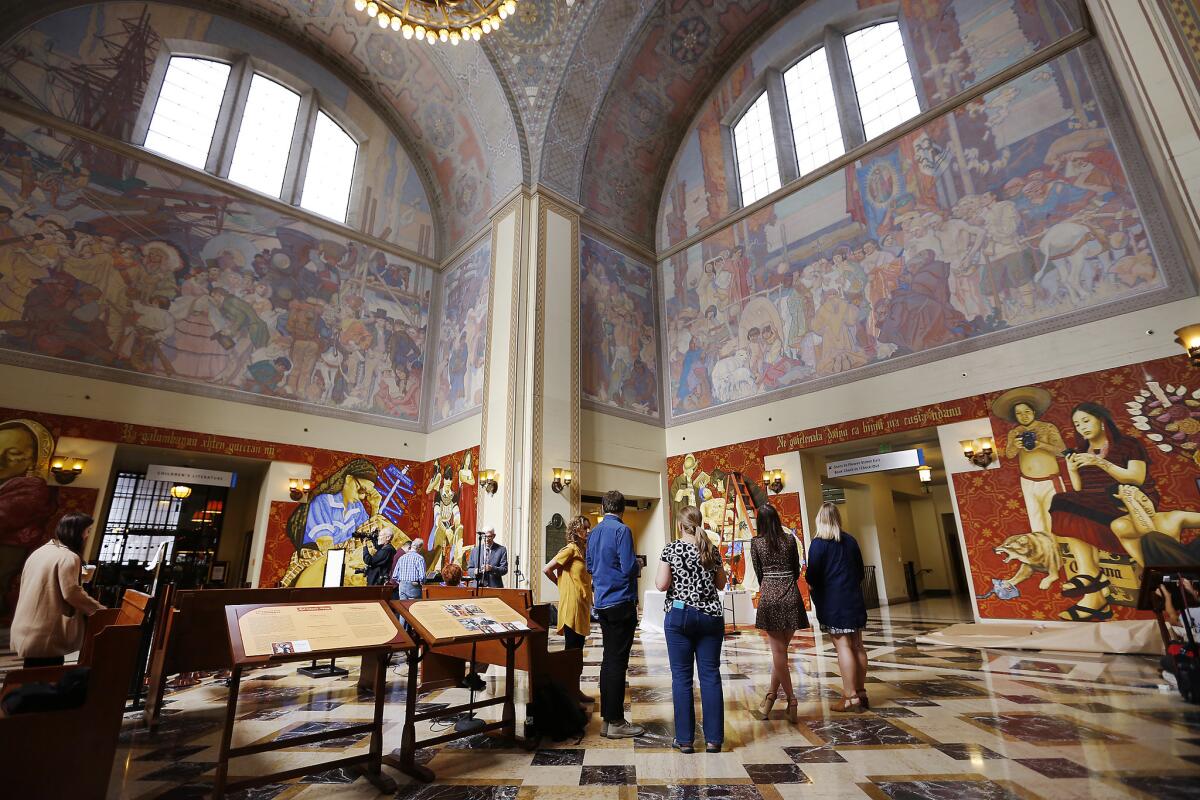 The 1933 Dean Cornwell artwork above, the 2017 Tlacolulokos murals below. (Al Seib / Los Angeles Times)