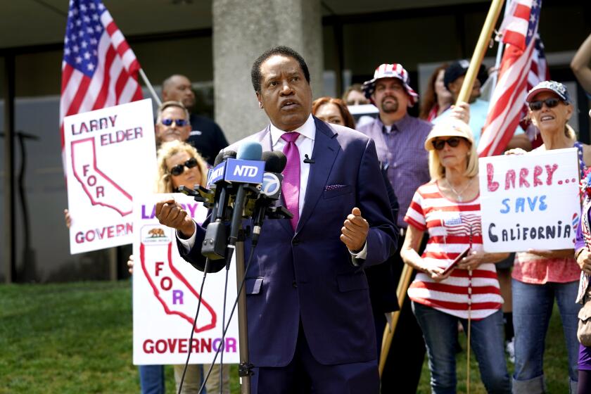 FILE — In this July 13, 2021 file photo radio talk show host Larry Elder speaks to supporters during a campaign stop in Norwalk, Calif. Californians will start receiving ballots next month asking if Gov. Gavin Newsom, a Democrat should be recalled and if so, who they want to vote to replace him. Elder is one of several high-profile Republicans, who are running to replace Newsom. The CAGOP's executive committee will meet Saturday July 24, 2021 and decide whether to let an endorsement move forward. (AP Photo/Marcio Jose Sanchez, File)