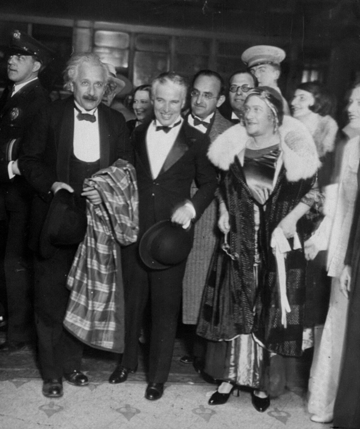 Albert and Elsa Einstein accompany actor-director Charlie Chaplin to a movie premiere in 1931 