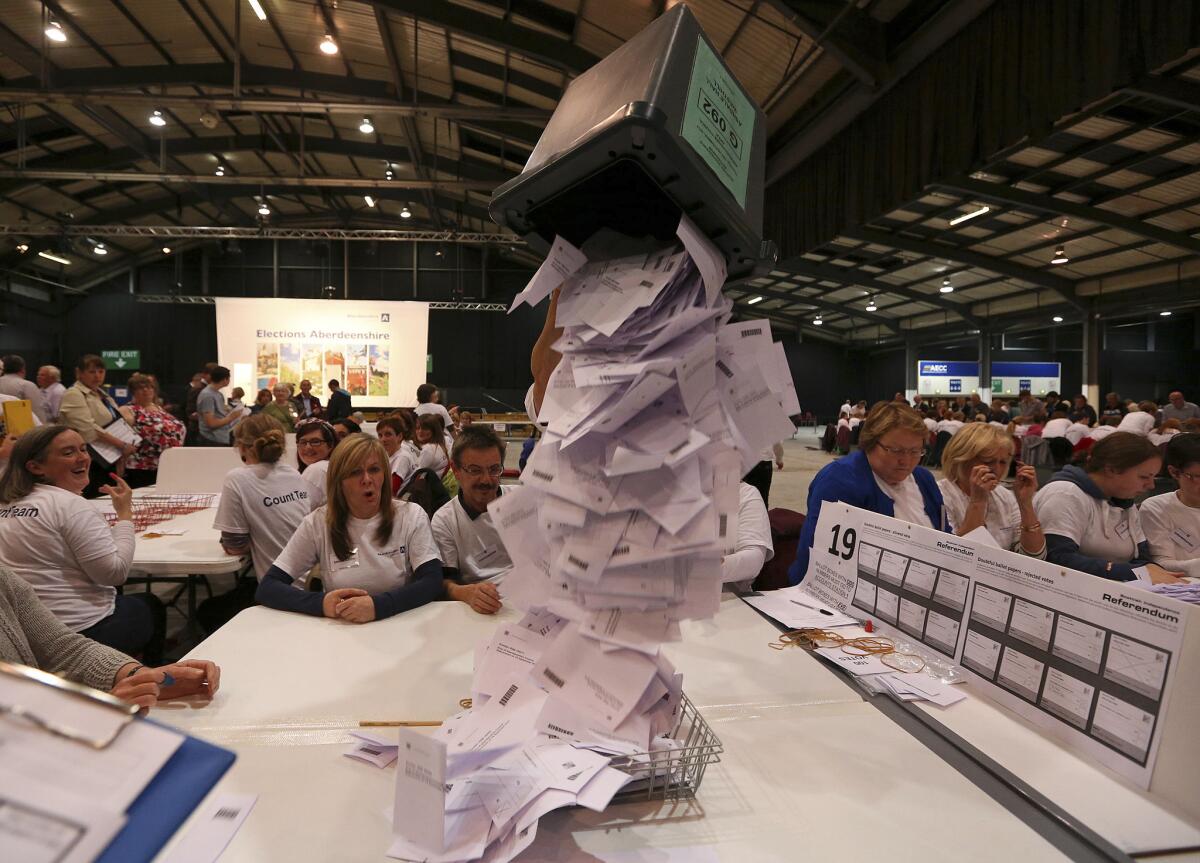 Ballot boxes are opened in Aberdeen as counting begins in the Scottish independence referendum.