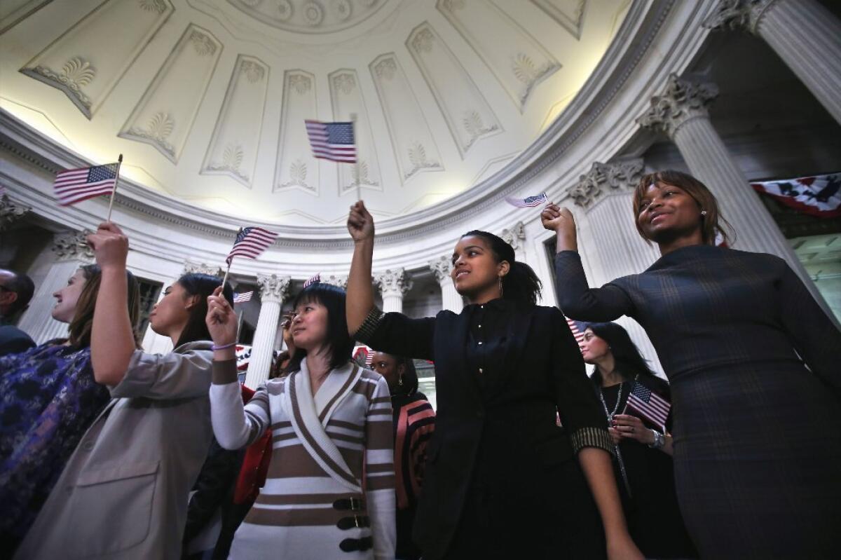 Immigrants celebrate after becoming U.S. citizens at a naturalization ceremony at Federal Hall on March 22, 2013, in New York City.