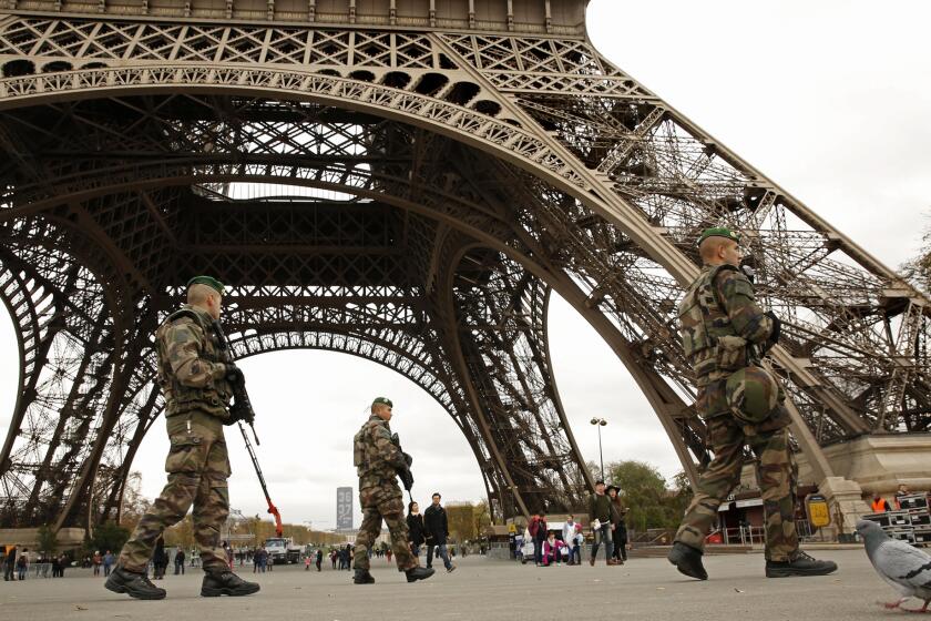 Members of the French Foreign Legion guard near the Eiffel Tower on Nov. 16, 2015.