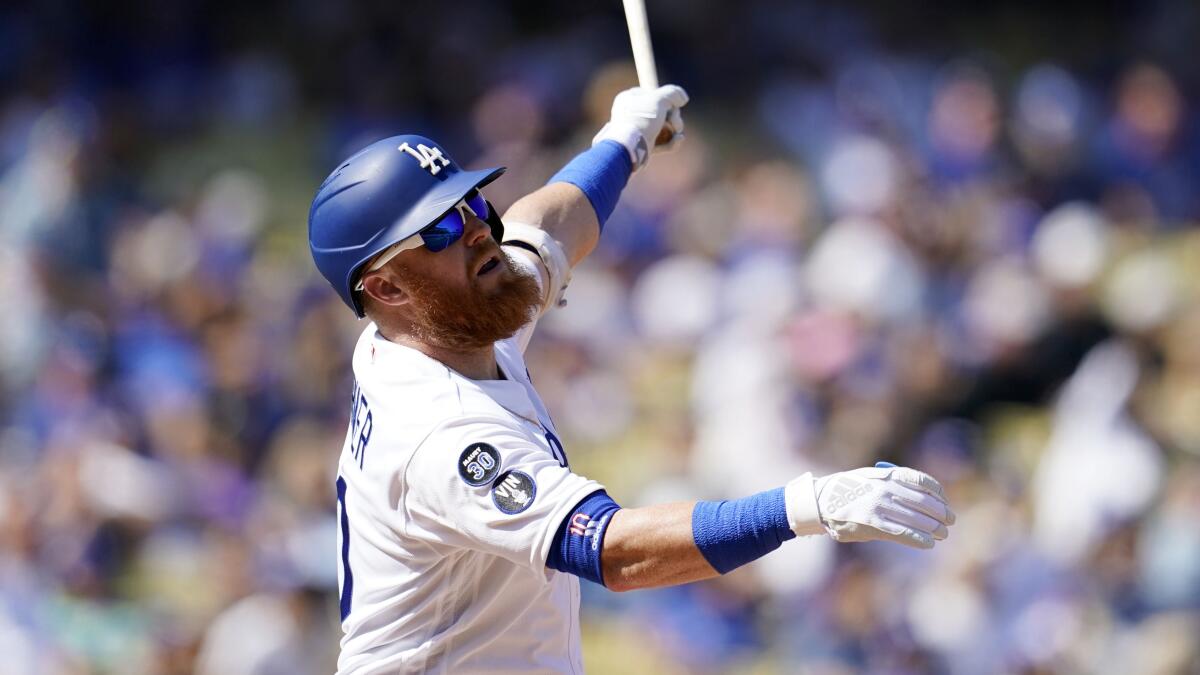 Dodgers third baseman Justin Turner hits against the Colorado Rockies on Oct. 5.