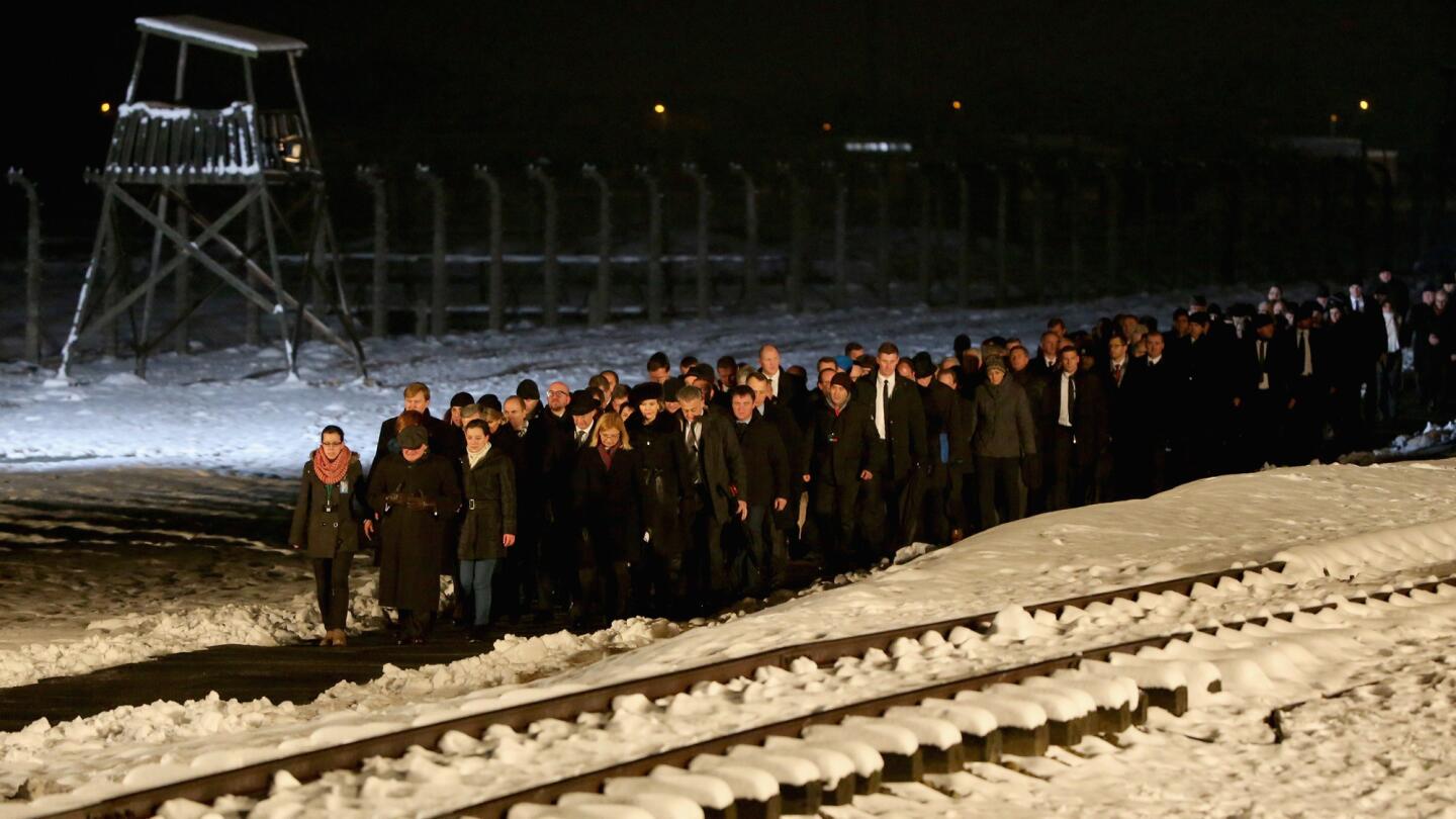 Delegations and survivors make their way to lay candles at the Birkenau Memorial during the commemoration of the 70th anniversary of the liberation of Auschwitz in Oswiecim, Poland, on Tuesday.