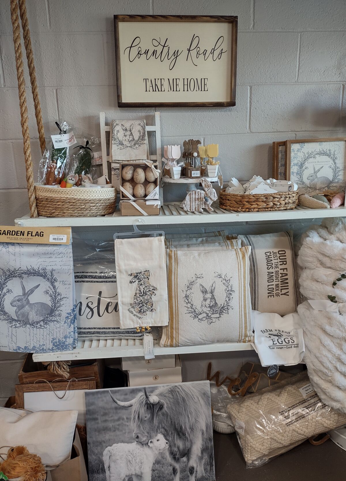 Seasonal Easter decorations line the shelves of a section of Rustic Interiors.