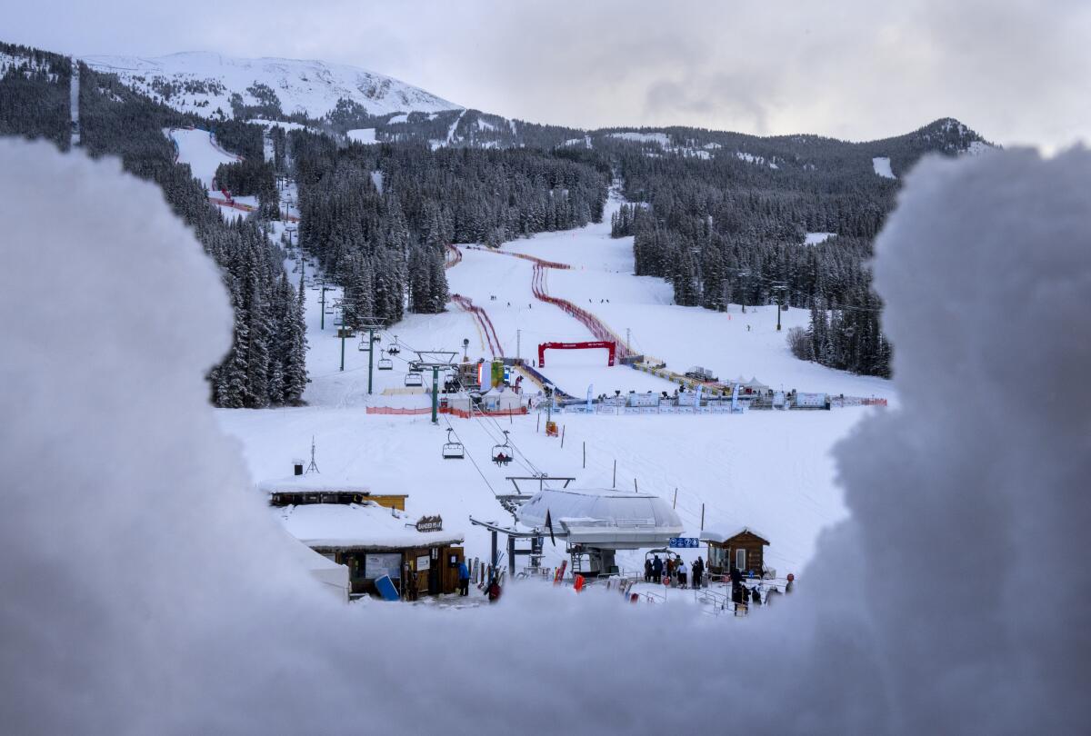 The race course is framed by fresh snowfall after the cancelation of the FIS World Cup downhill ski race in Lake Louise, Alberta on Friday Nov. 26, 2021. The race was cancelled due to too much snow on the course. (Frank Gunn/The Canadian Press via AP)