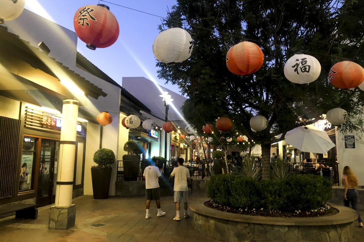 A plaza with hanging paper lanterns