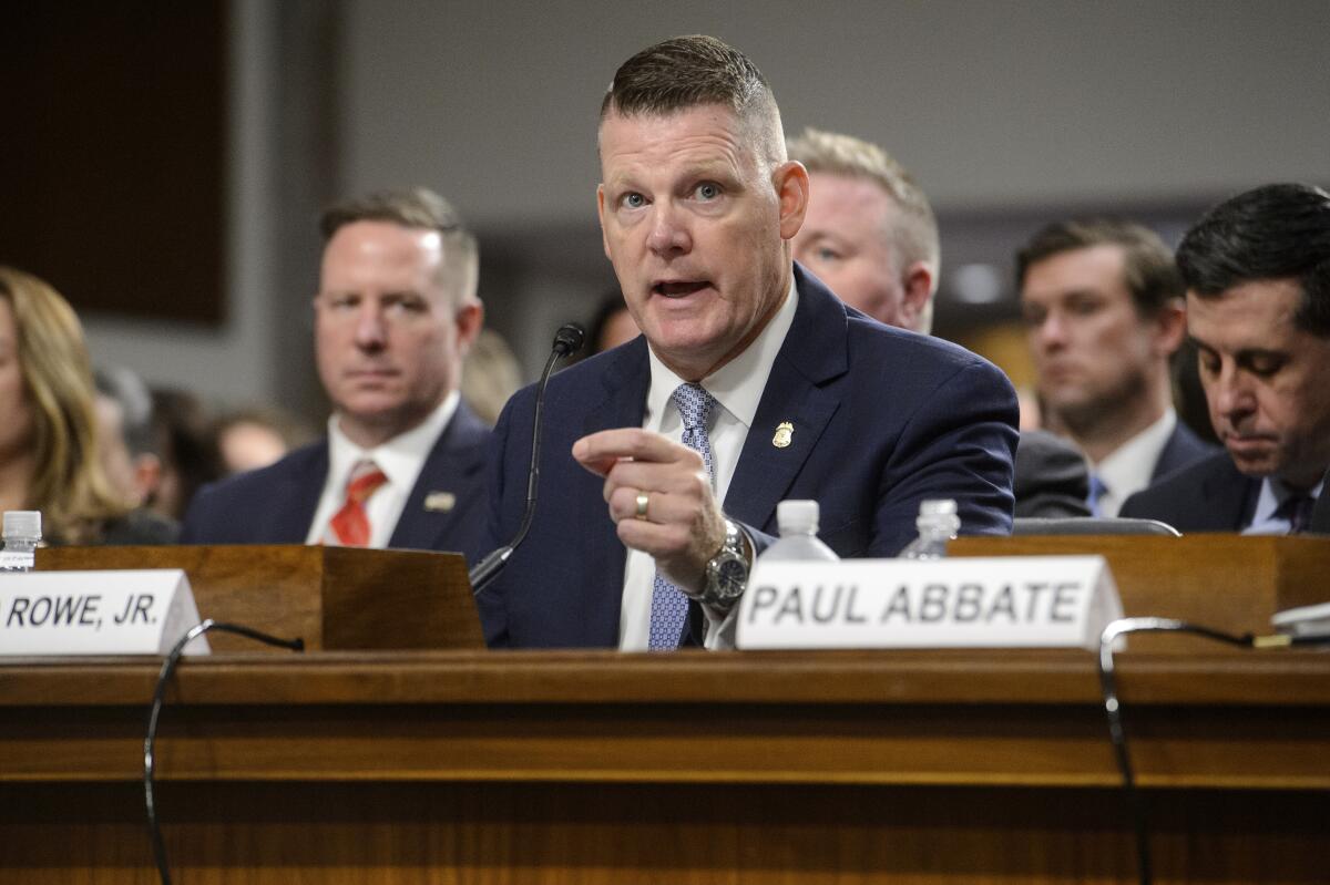 Ronald Rowe Jr. testifies during a Senate committee meeting.  