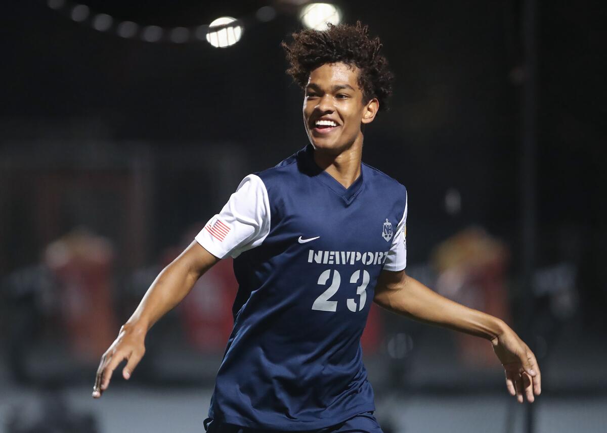 Newport Harbor's Olivier Renard runs off to celebrate a goal with teammates against Oxnard Pacifica on Tuesday.