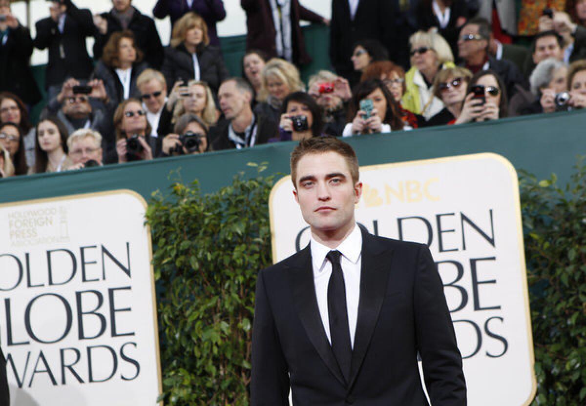 Robert Pattinson arrives for the 70th Annual Golden Globe Awards show at the Beverly Hilton Hotel.