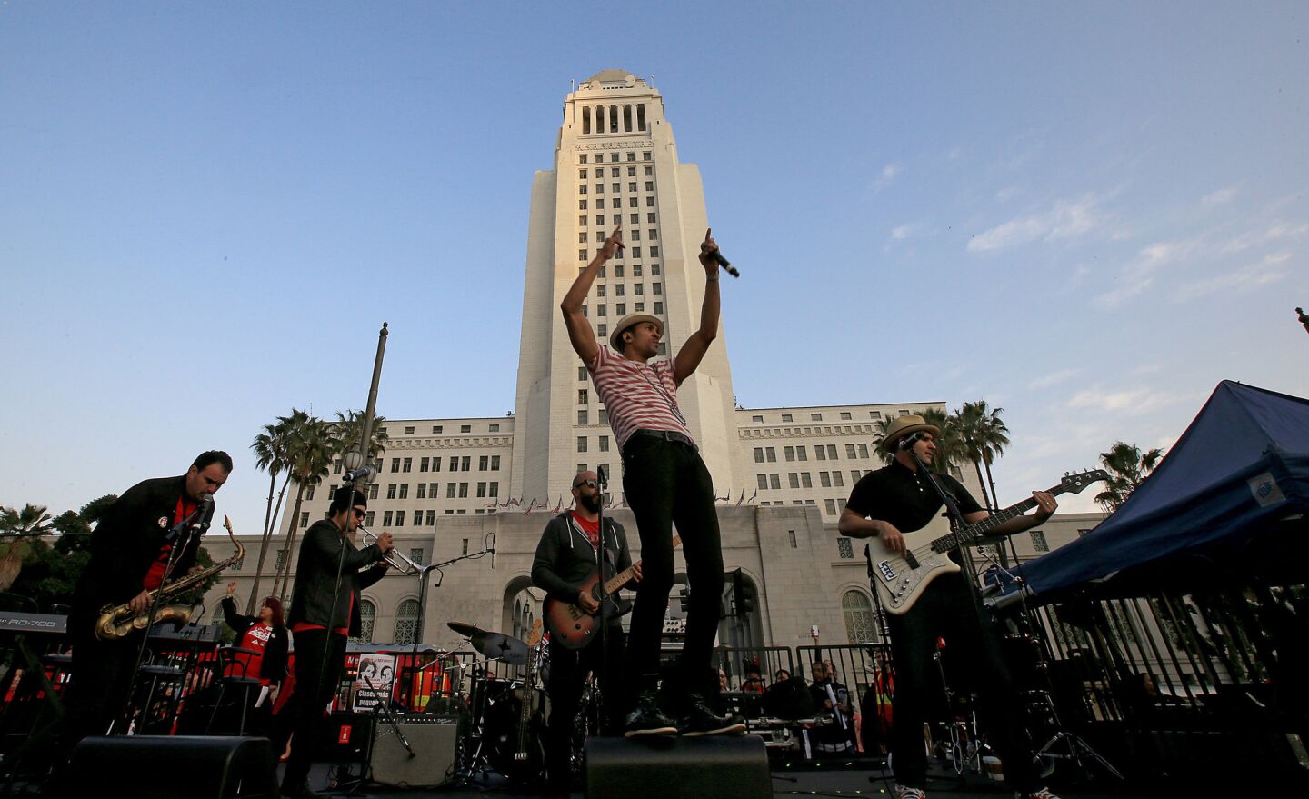 L.A.-based band Ozomatli performs for thousands of teachers rallying for contract demands in downtown's Grand Park.