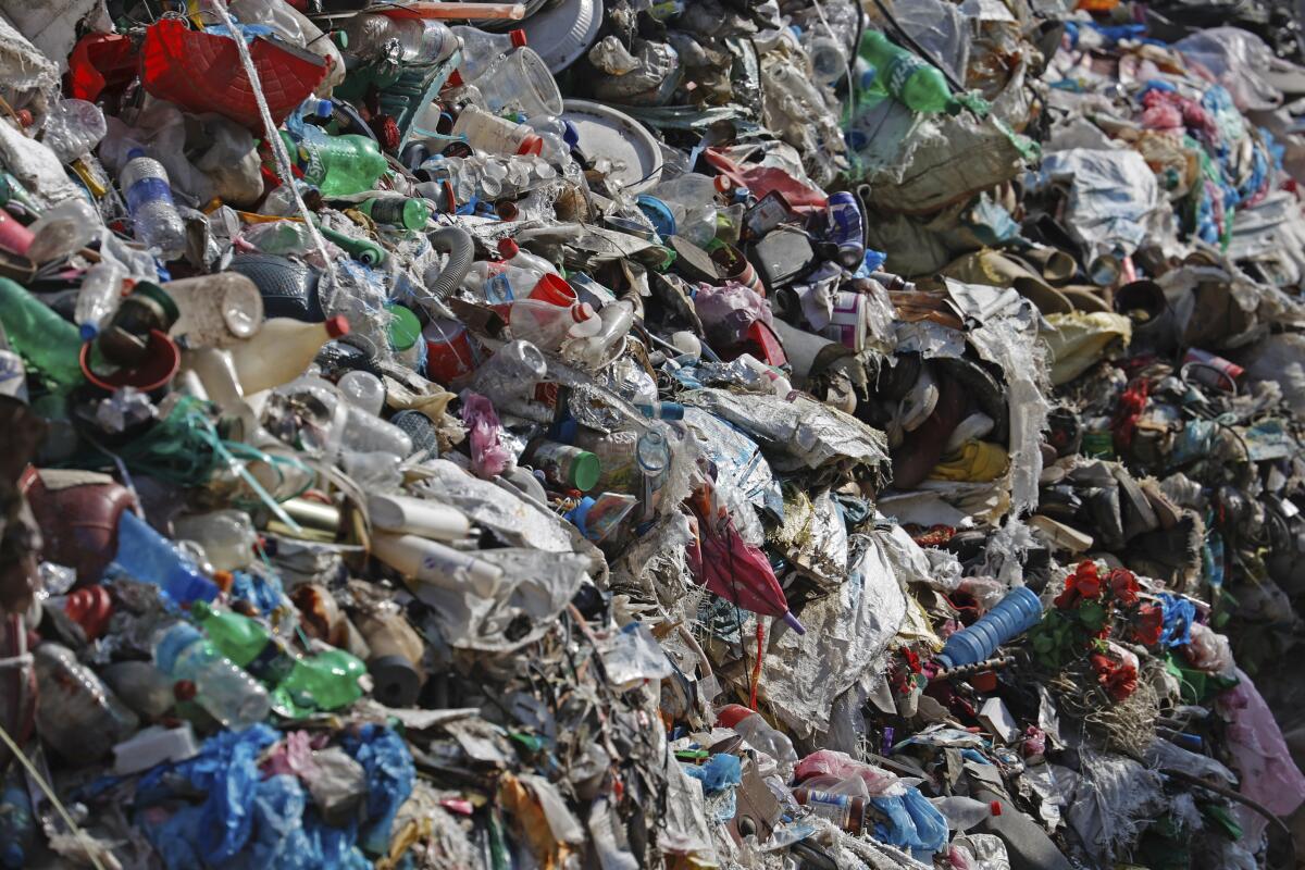 Garbage collected from Mount Everest is piled before it is sorted for recycling in Kathmandu, Nepal.