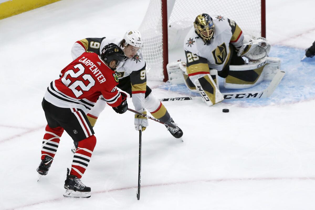 Chicago Blackhawks center Kirby Dach, right, celebrates his tying