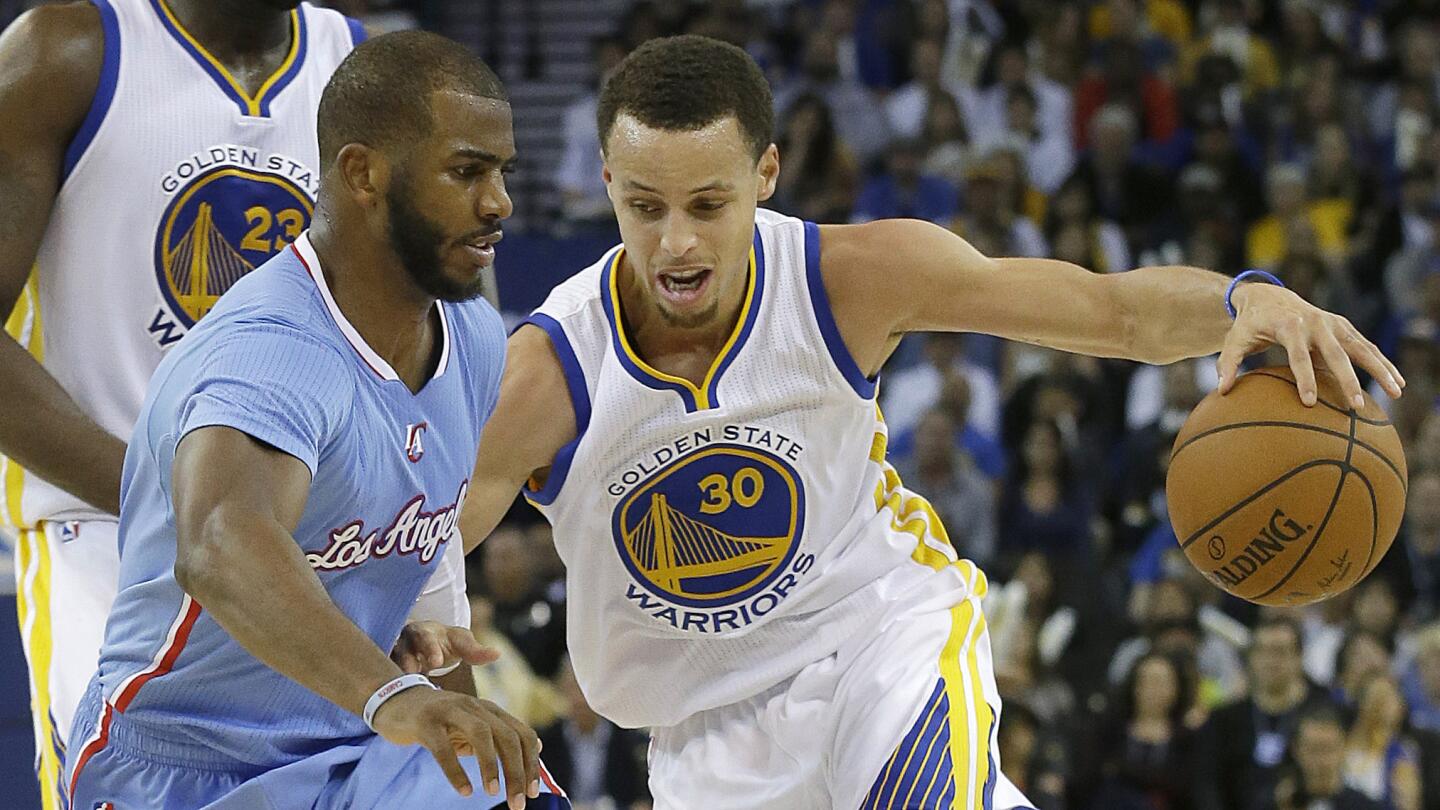 Golden State Warriors guard Stephen Curry, right, tries to drive past Clippers guard Chris Paul during the second half of the Clippers' 106-98 loss on March 8, 2015.
