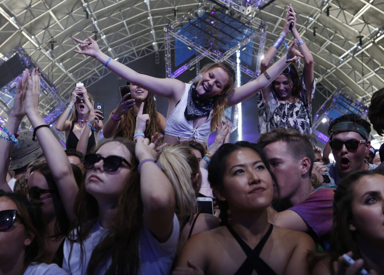 Fans ride on people's shoulders as Vanic performs at Coachella.
