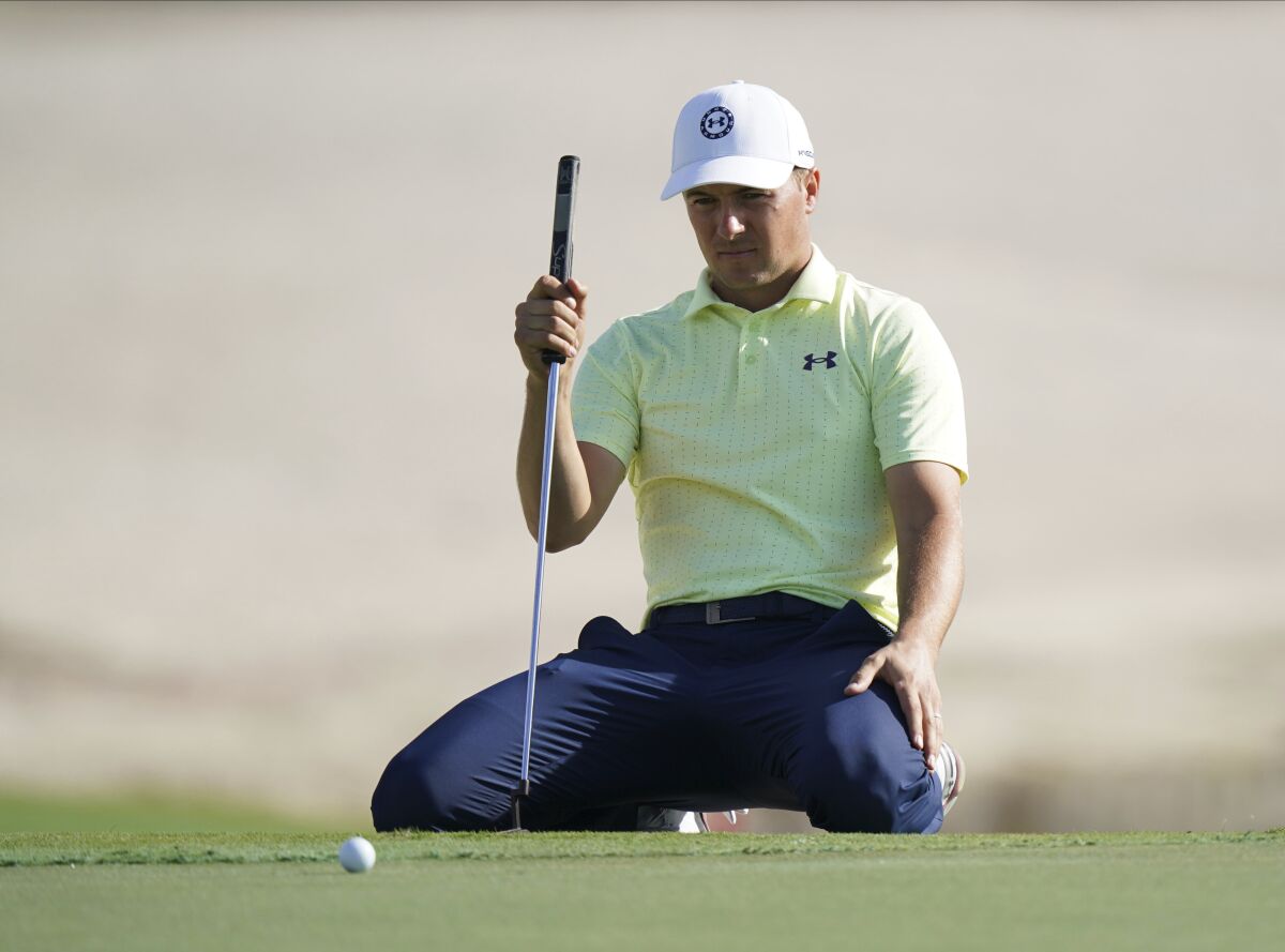 Jordan Spieth, of the United States, lines up his putt on the 17th green during the second round of the Hero World Challenge PGA Tour at the Albany Golf Club, in New Providence, Bahamas, Friday, Dec. 3, 2021.(AP Photo/Fernando Llano)