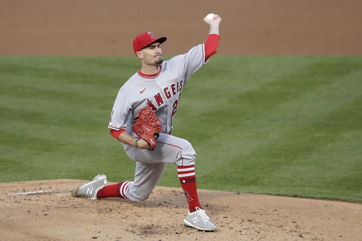 Angels pitcher Andrew Heaney throws against the Athletics in the first inning July 24, 2020.