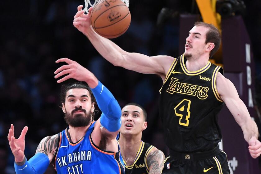 LOS ANGELES, CALIFORNIA FEBRUARY 8, 2018-Lakers Alex Caruso steps in front of Thunders Steven Adams to steal the ball in the 2nd quarter at the Staples Center Thursday. (Wally Skalij/Los Angeles Times)