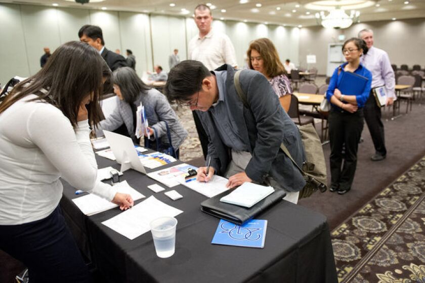 California employers added 45,800 jobs in October. The unemployment rate dipped slightly to 10.1% from 10.2%. Above, applicants at a job fair in Concord, Calif.