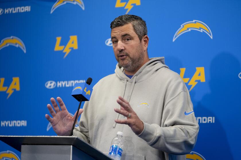Chargers defensive line coach Mike Elston speaks during a news conference.