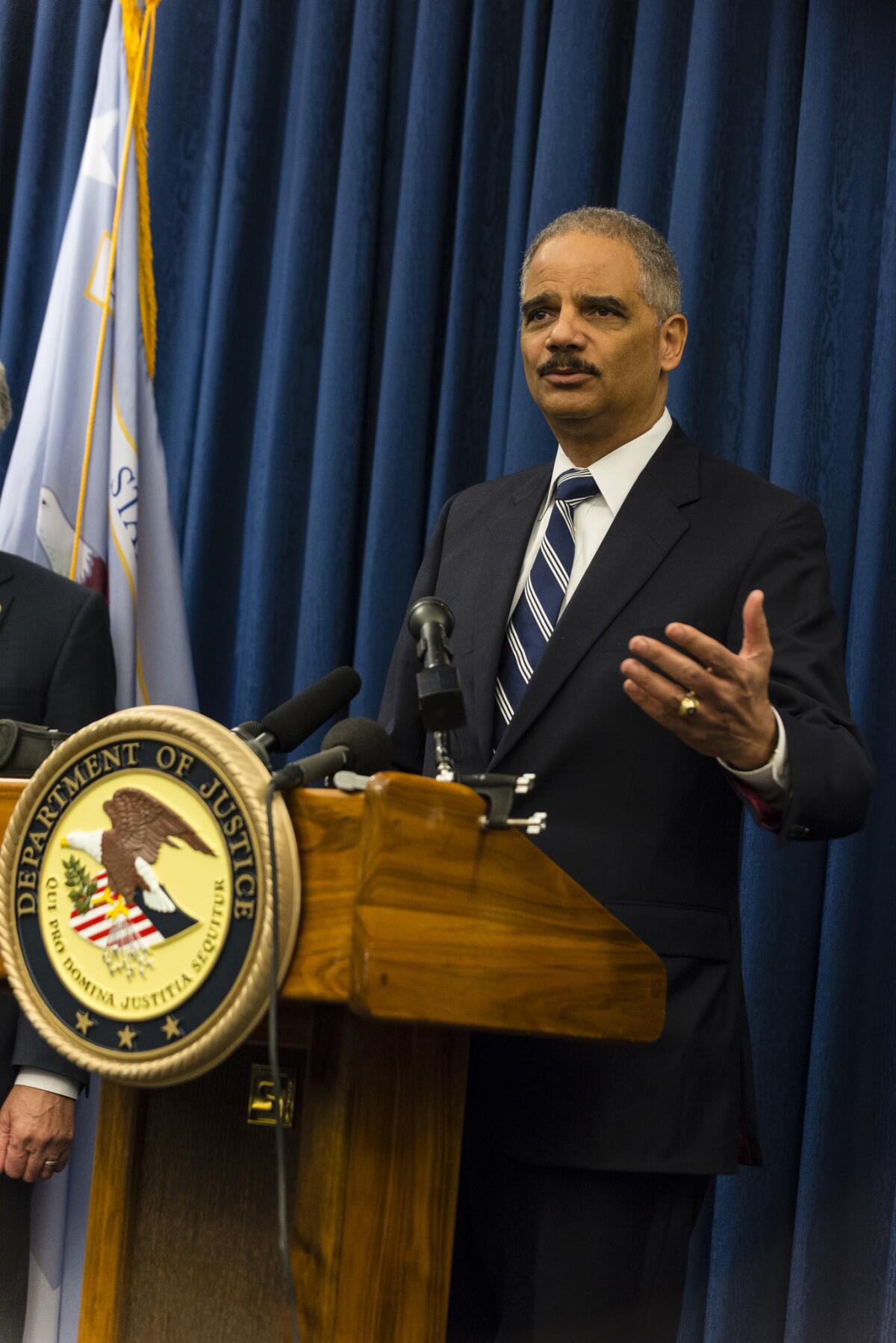 U.S. Attorney General Eric Holder speaks to reporters at a press conference on December 4, 2014 oin Cleveland, Ohio.