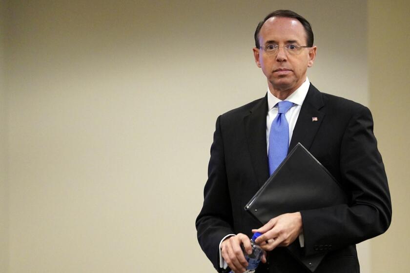 Deputy Attorney General Rod Rosenstein waits to speak at a law enforcement roundtable on improving the identification and reporting of hate crimes at Department of Justice Monday, Oct. 29, 2018, in Washington. (AP Photo/Pablo Martinez Monsivais)