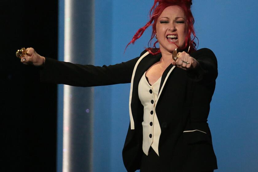 Cyndi Lauper accepts the musical theater album award for "Kinky Boots" at the pre-telecast of the Grammy Awards on Sunday at the Nokia Theatre in Los Angeles.