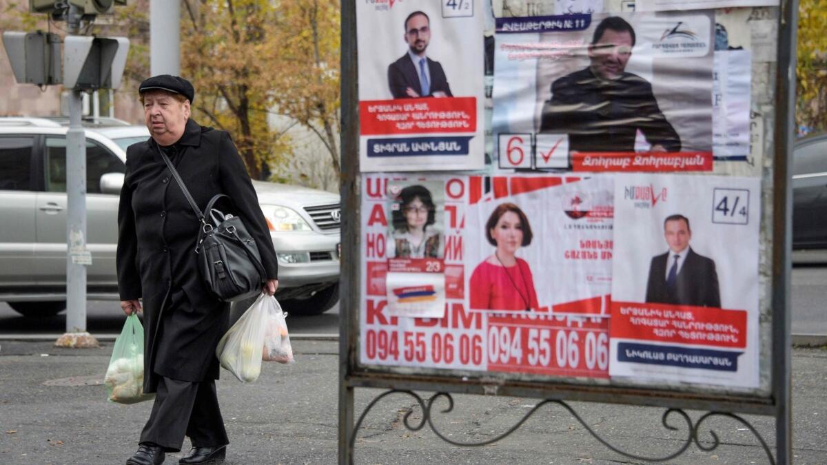 Election posters hang in Yerevan, Armenia, before the Dec. 9 early parliamentary vote.