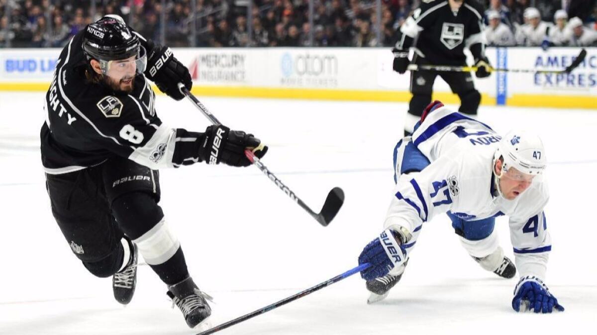 Kings defenseman Drew Doughty (8) takes a slap shot as Maple Leafs' Leo Komarov (47) attempts to block during the second period on Mar. 2.