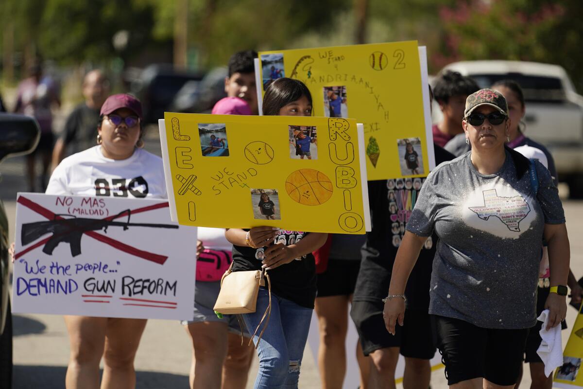 Protesters holding signs