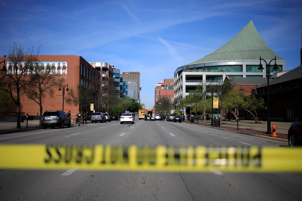 Crime scene tape cordons off a street in Louisville, Ky.