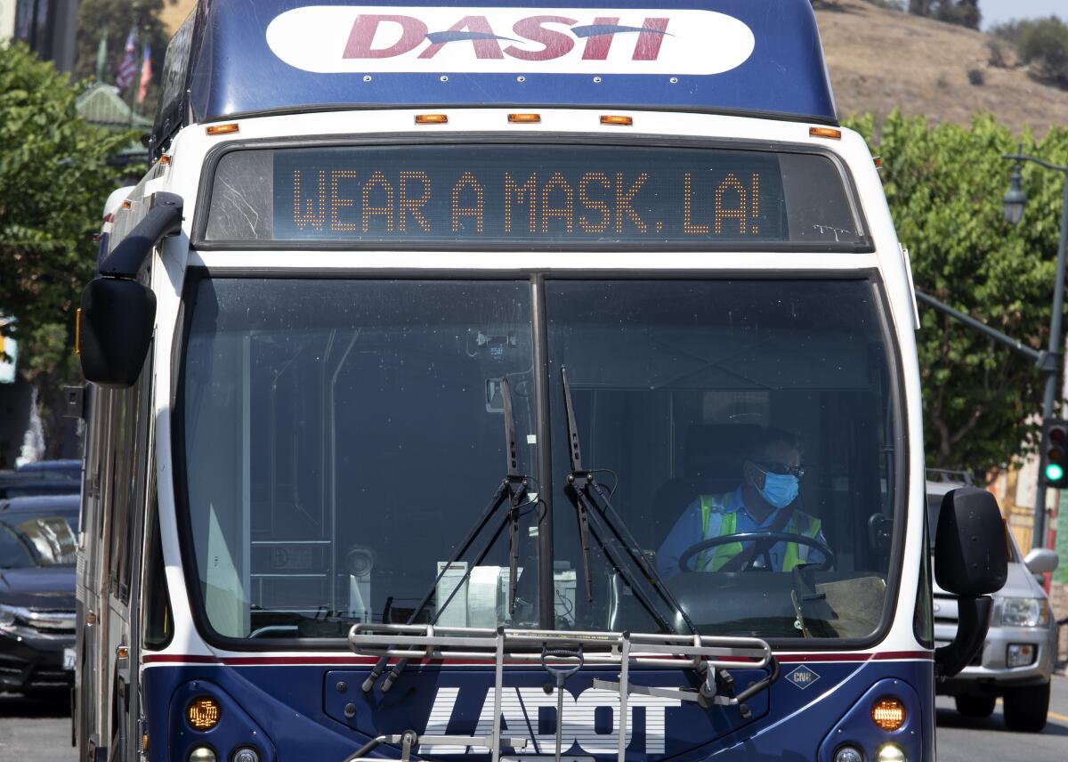 A bus in Chinatown encourages people to mask up in July 2021.