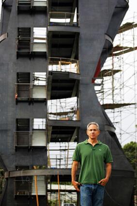 Eric Owen Moss stands near the Gateway Art Tower, which is under construction in Culver City. He is the architect for the project, which is an exposed steel structure and has two levels below ground.