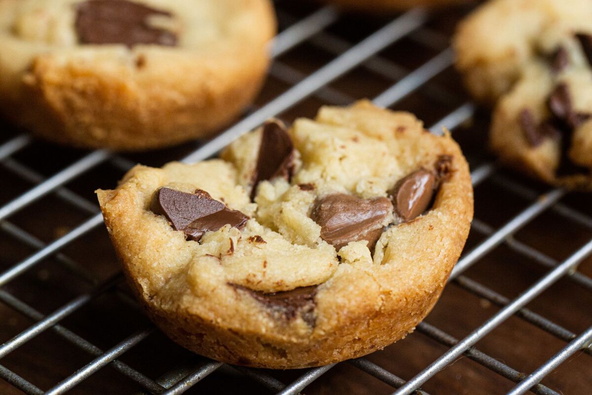 These “caramel” chocolate chip cookies are baked in muffin tins, which produces crisp edges of buttery, crumbly shortbread.