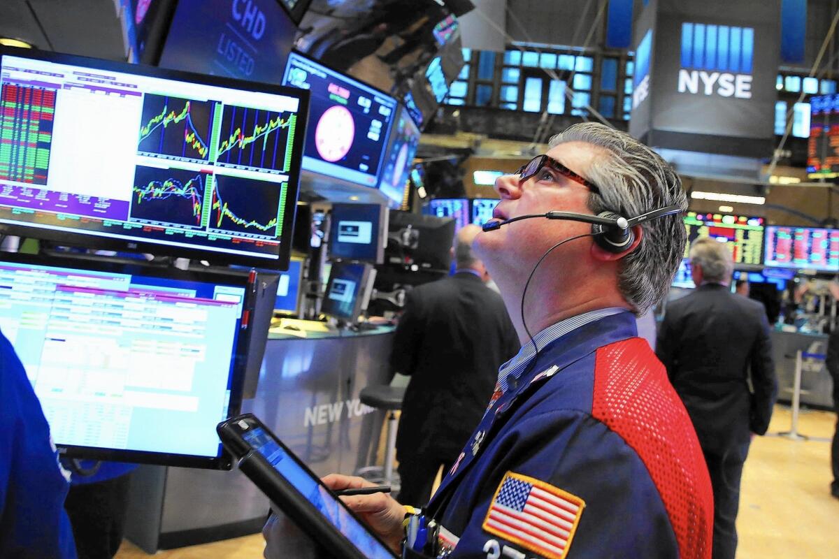 Traders work on the floor of the New York Stock Exchange this week. The benchmark Standard & Poor’s 500 index tumbled 5.1% in January.