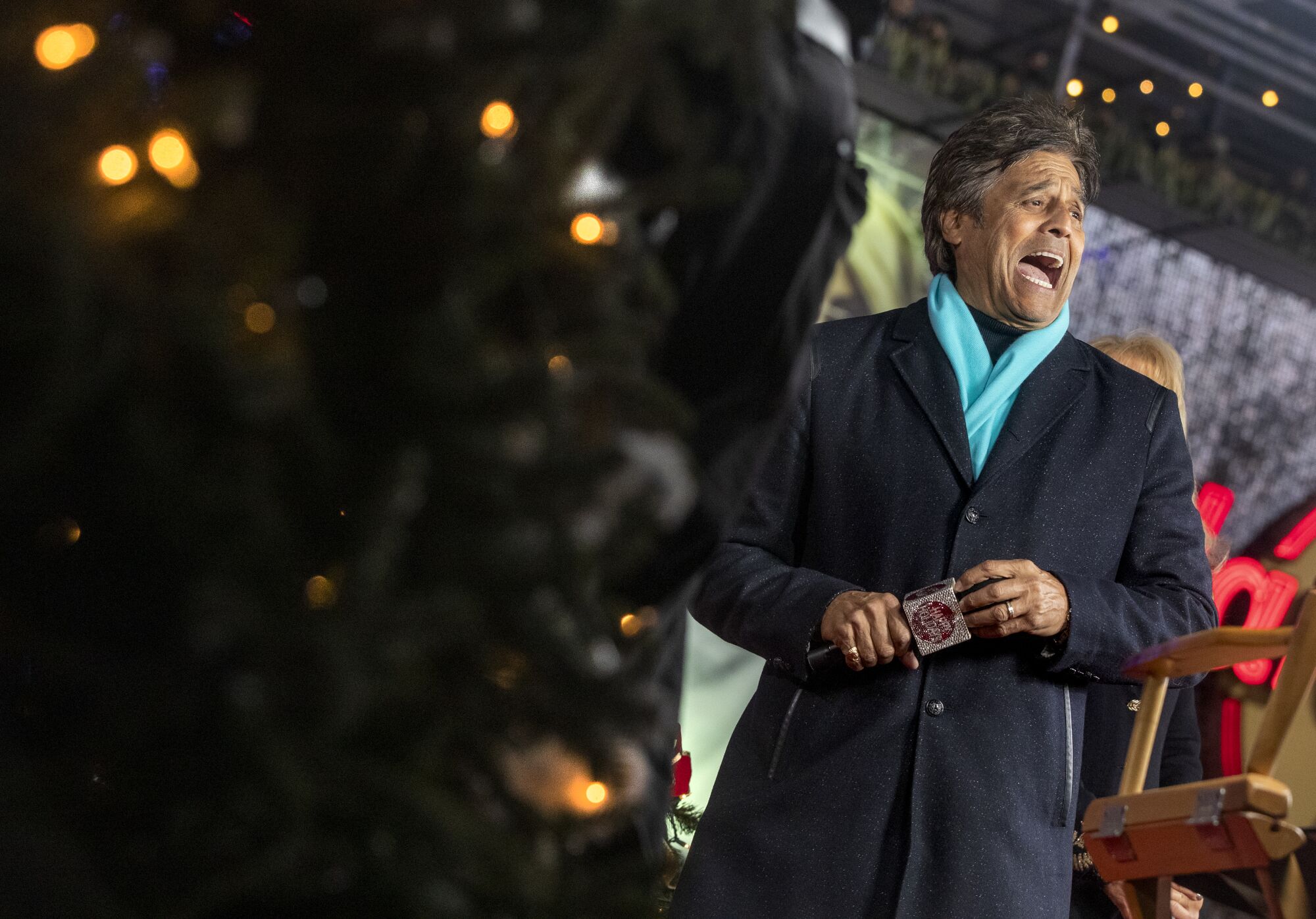 Host Erik Estrada shares a laugh backstage