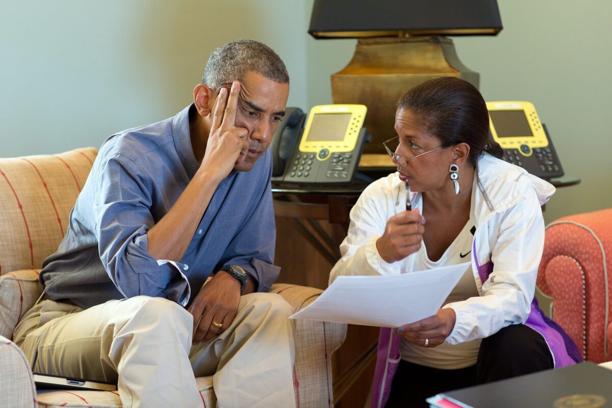 President Obama, left, meets with National Security Advisor Susan E. Rice following foreign leader phone calls, from Chilmark, Mass. Obama said the naming of a new prime minister in Baghdad is a promising step forward in the effort to form a unifying Iraqi government.