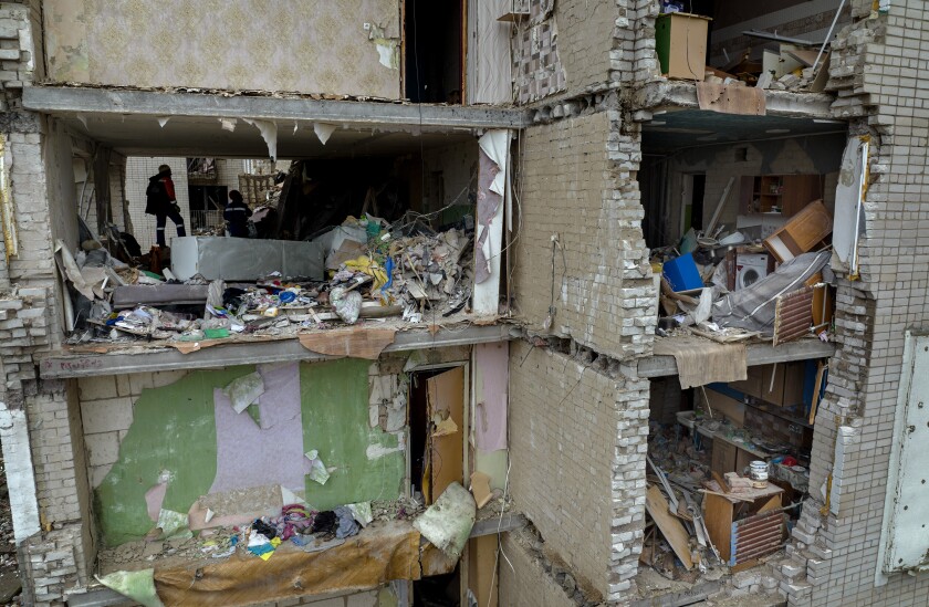 A damaged building with interiors exposed